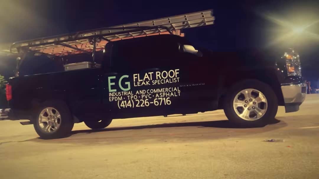 EG Flat Roof Leak specialist company truck wrapped with company info